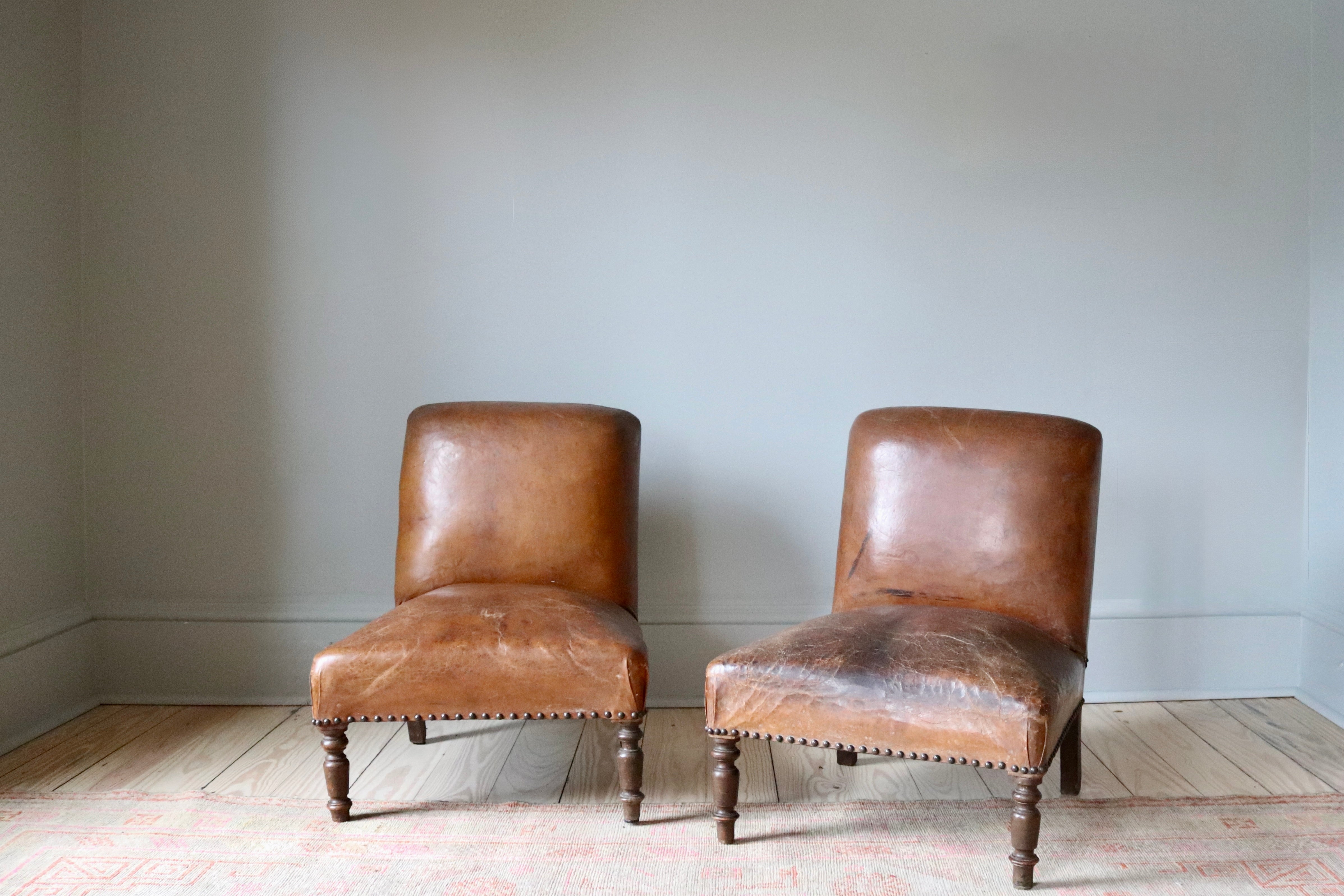 Pair of Antique Leather Slipper Chairs