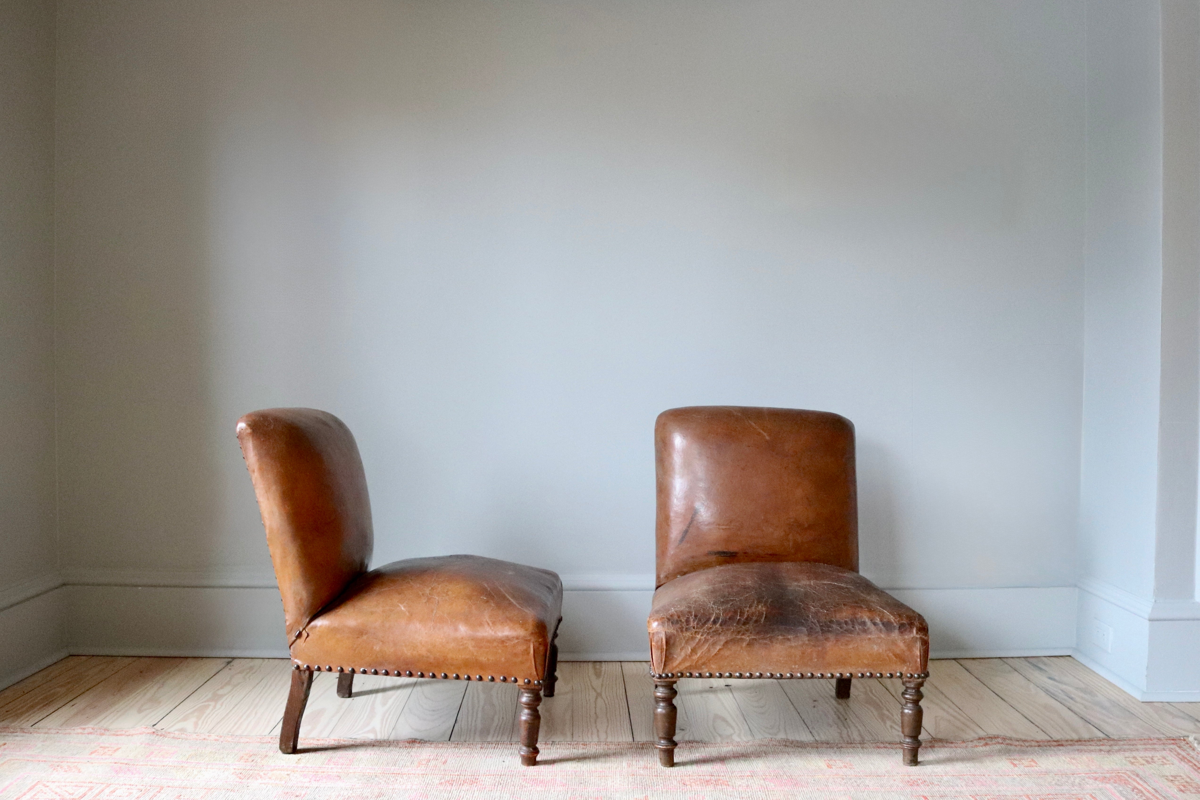 Pair of Antique Leather Slipper Chairs