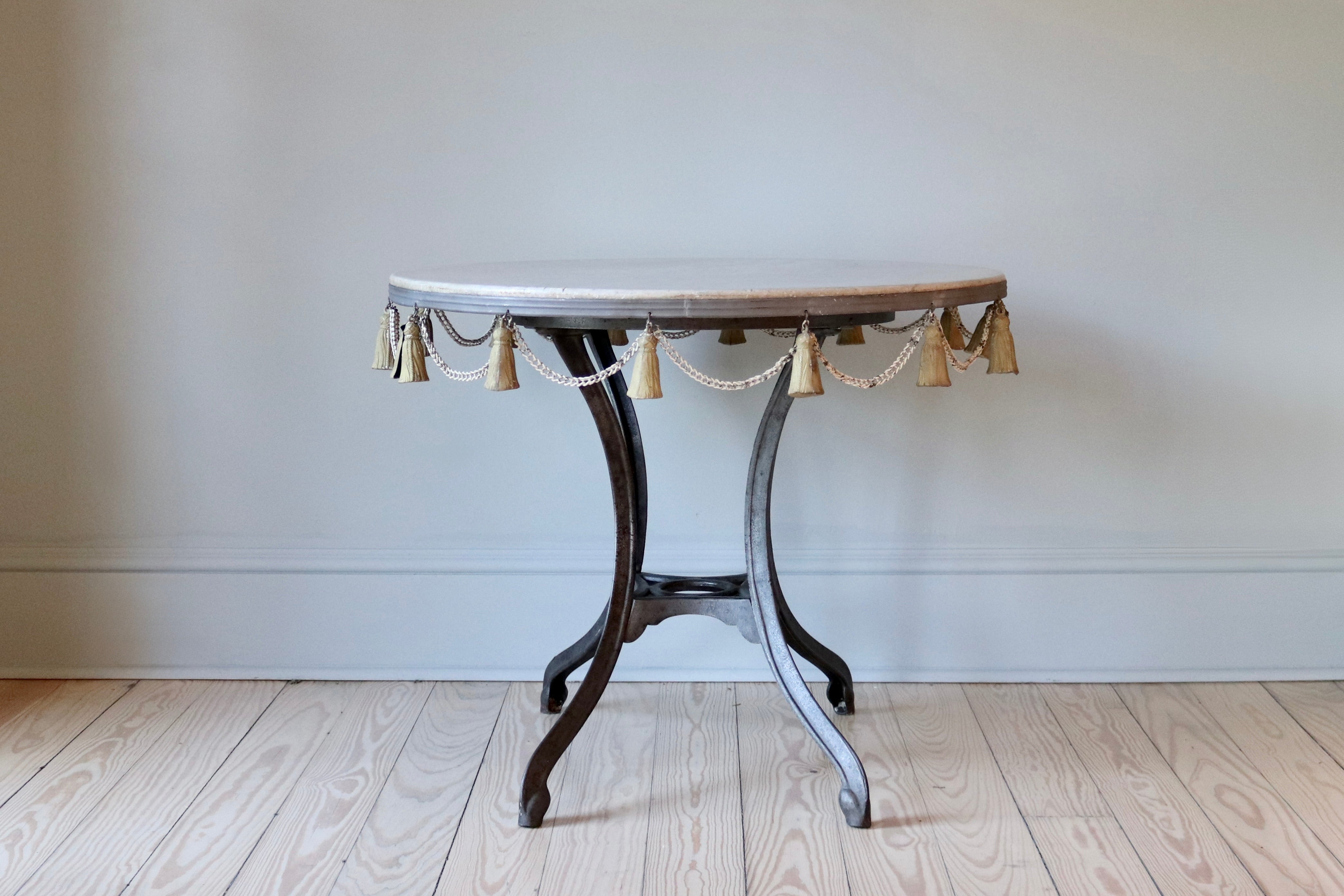 Round Garden Table with Marble Top & Tassel Accent