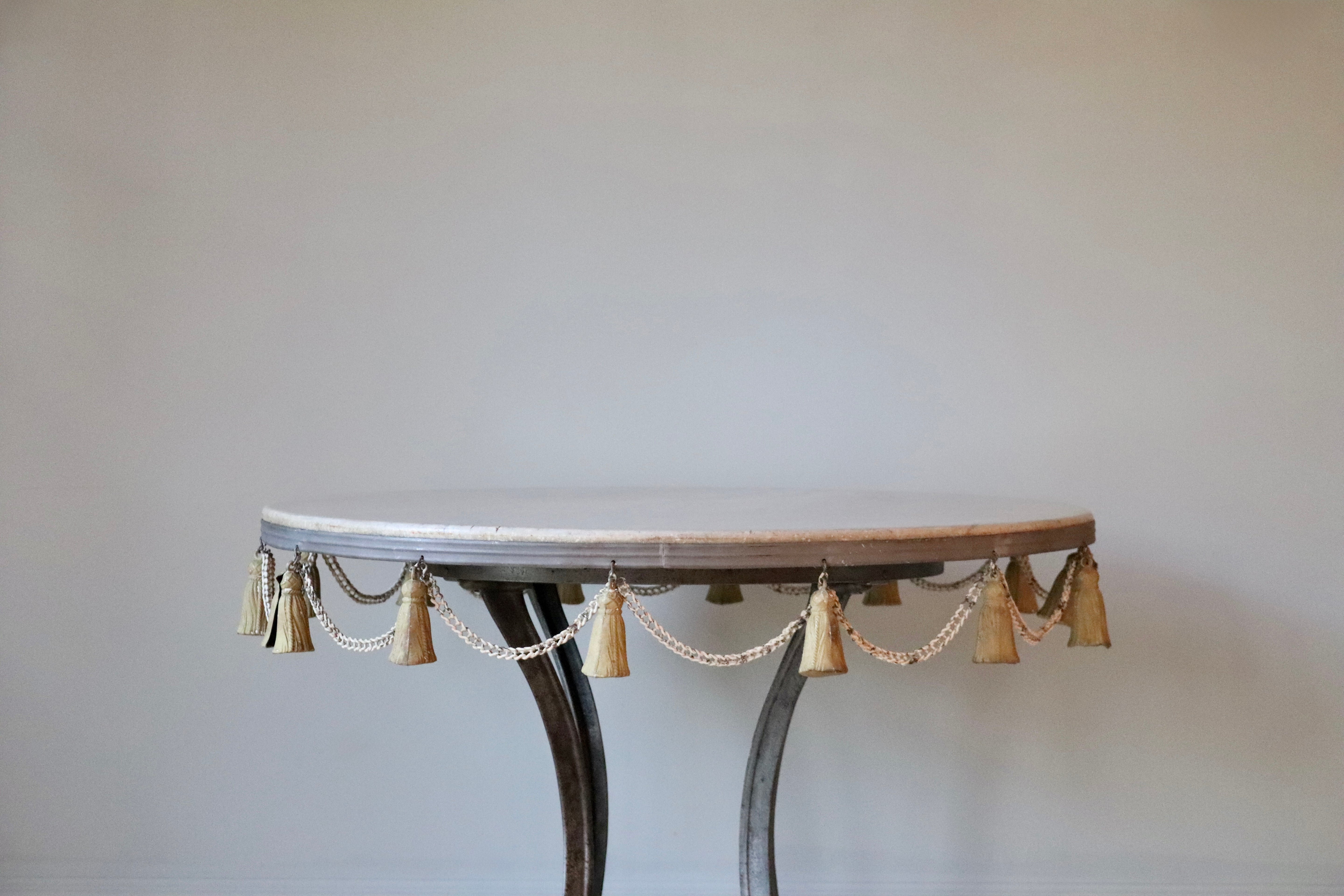 Round Garden Table with Marble Top & Tassel Accent